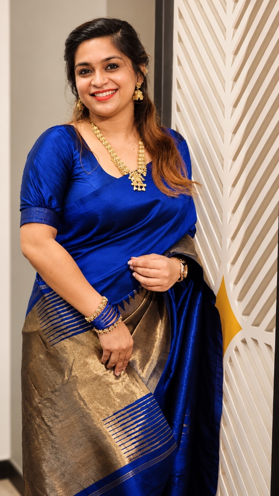 Festive royal blue silk saree with gold coin temple necklace and traditional bangles